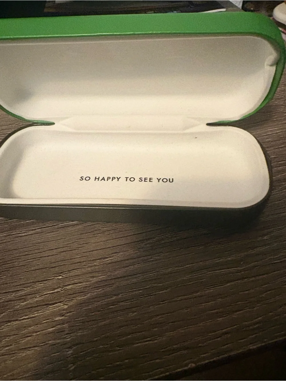 kate spade Green glass case. Has flaw on front.